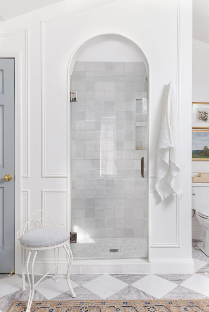 Curved arched shower in primary bathroom.