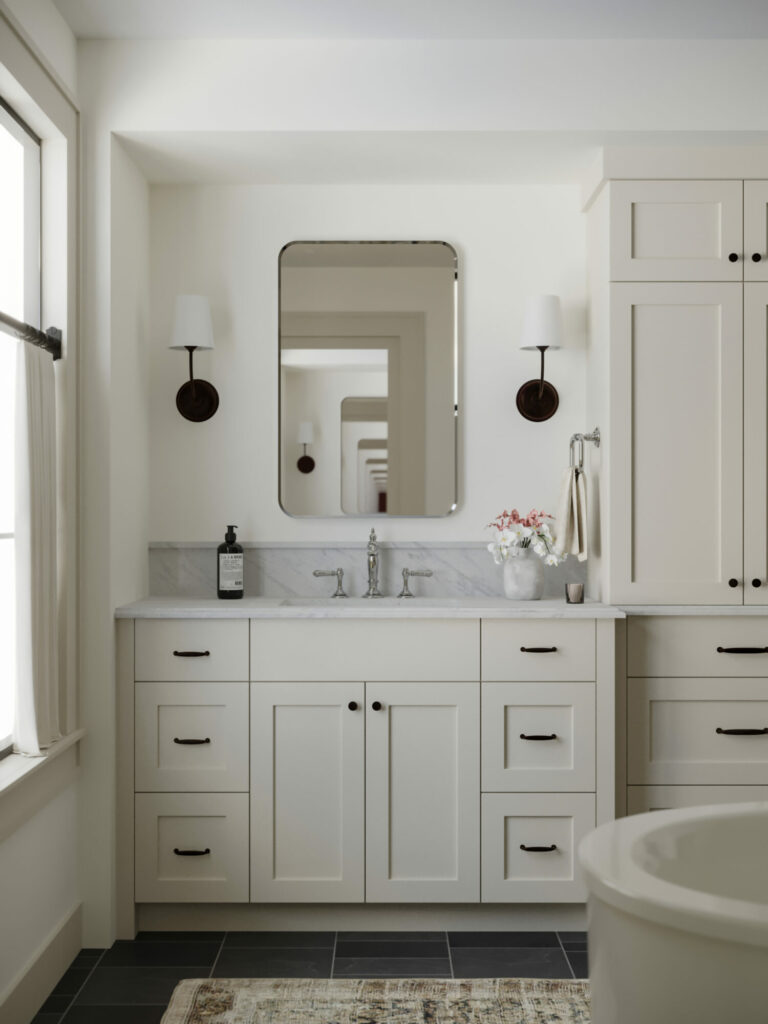 Bathroom with mixed metals of black and chrome.